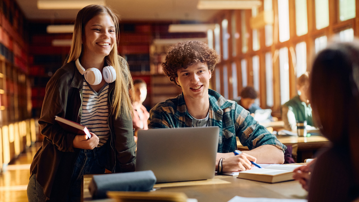 Students in higher education reading and talking about an automated marketing email.