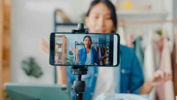 user generated content social media woman making a video using smartphone