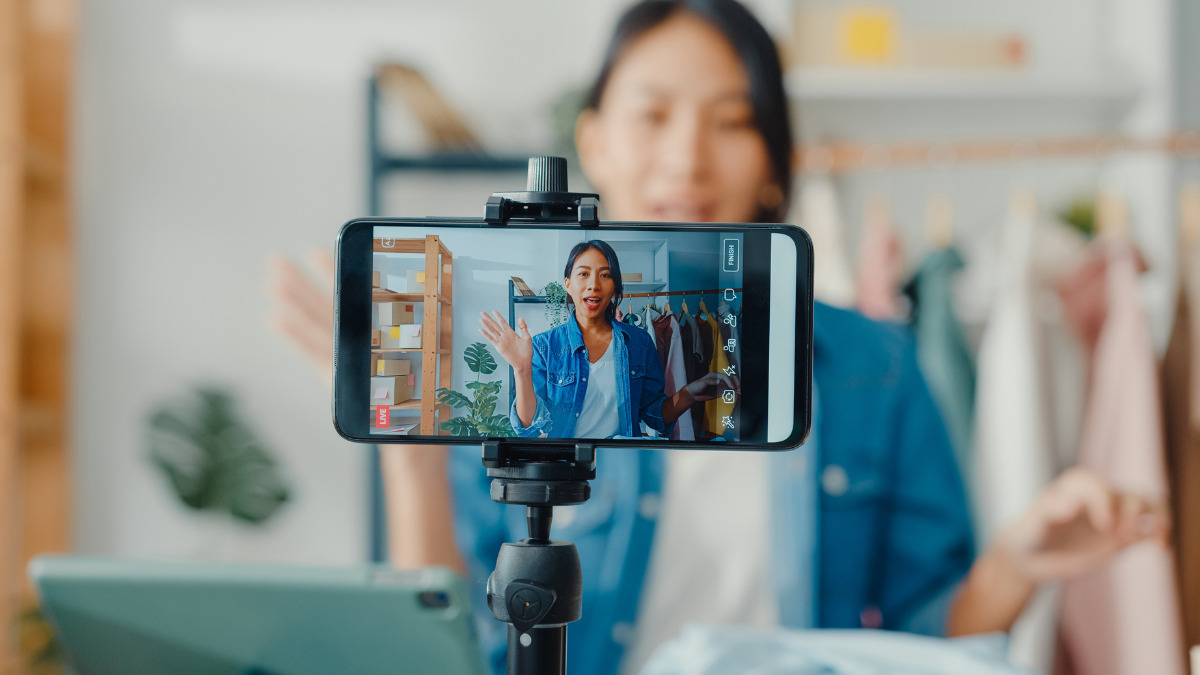 user generated content social media woman making a video using smartphone